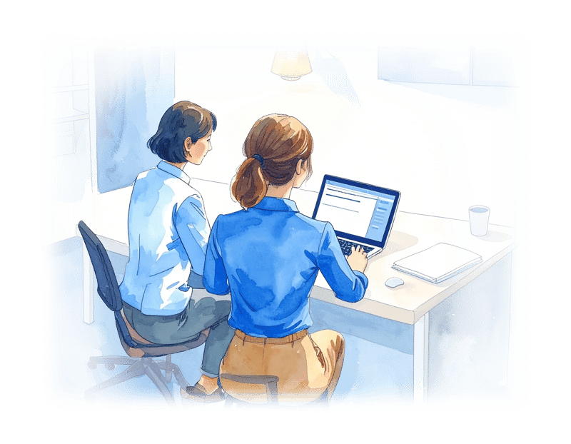 2women-adding-content-to-laptop